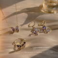 Shangjie OEM Joyas Fashion 18K Juego de joyas chapadas en oro Juego de joyas para mujeres Joya de joyería de mariposa de cristal púrpura